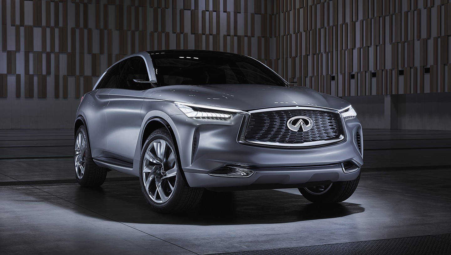 A black INFINITI Q70 sedan racing down a highway