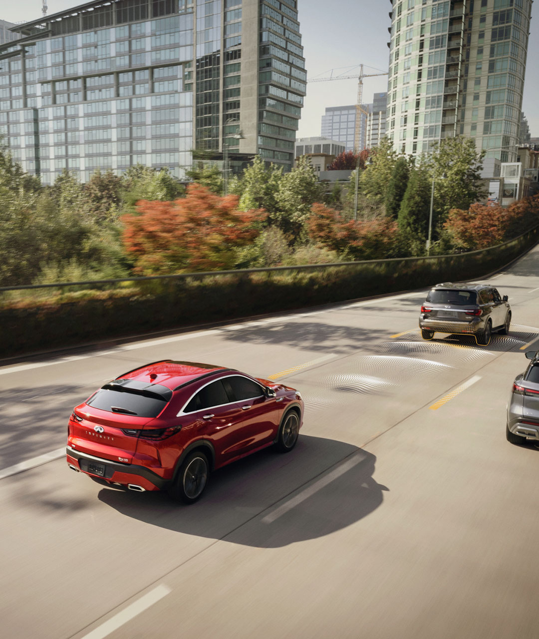 Overhead view of a red 2024 INFINITI QX55 crossover coupe using  IQ Tech