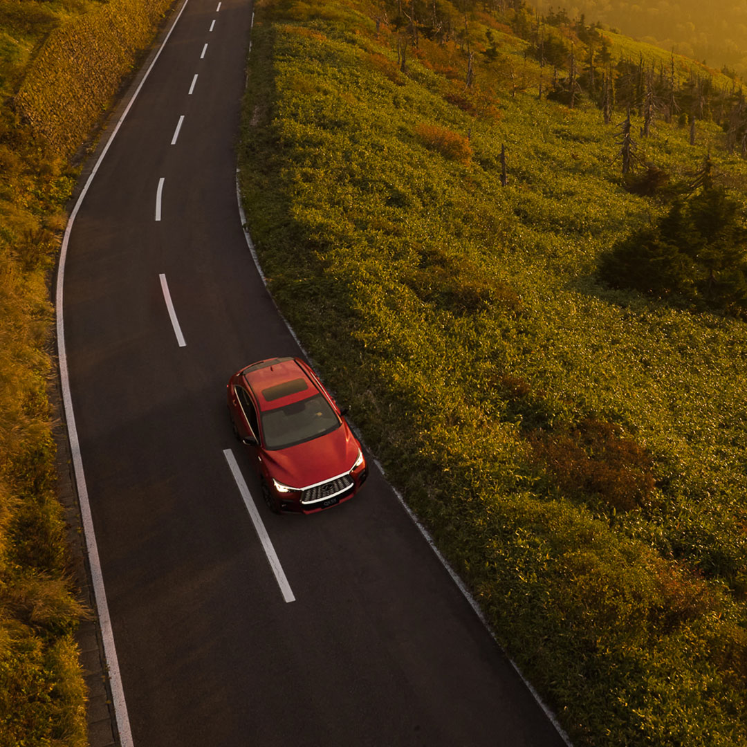 Overhead view of a red 2024 INFINITI QX55 crossover coupe with VC turbo engine