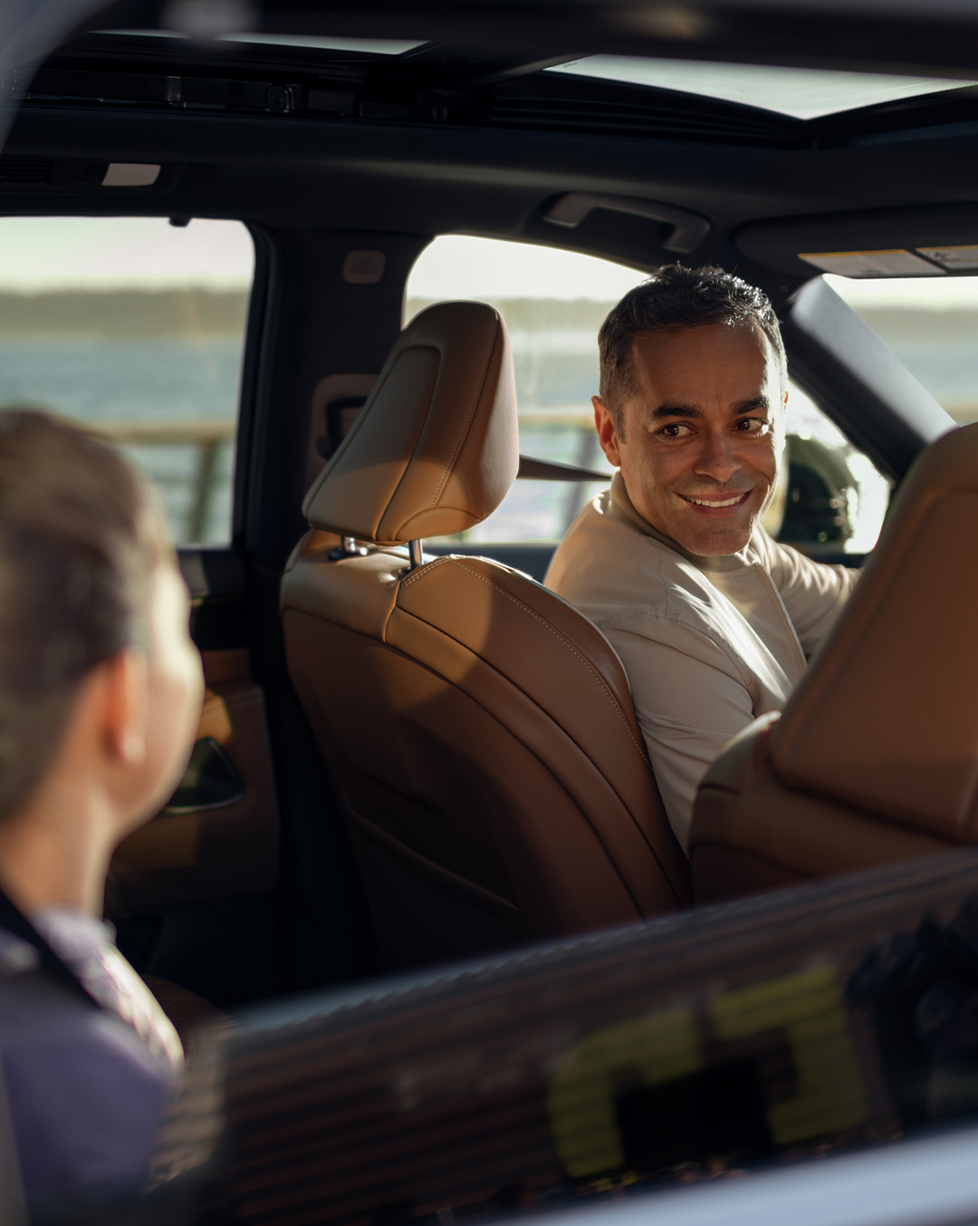 A father looking back in the 2024 INFINITI QX60 SUV