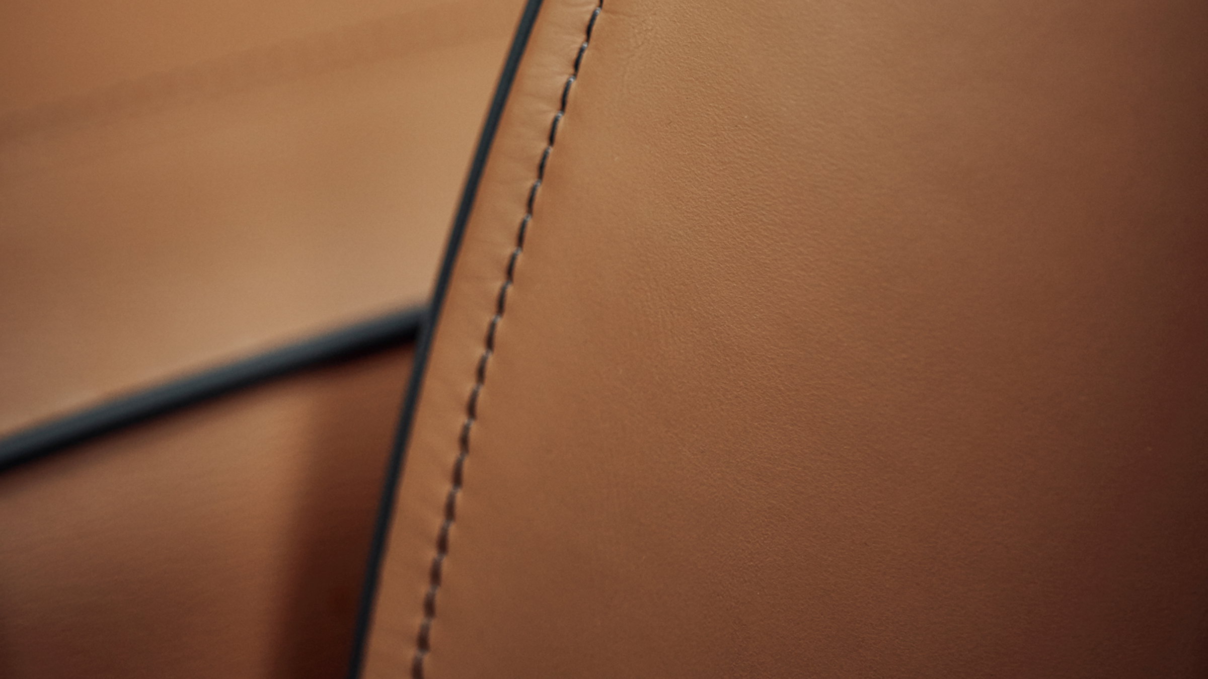 Close-up of 2022 INFINITI QX80 leather stitching.